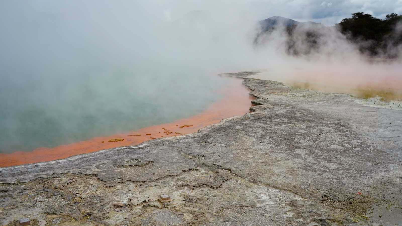Colorful hot spring, although you probably wouldn't want to bathe in this, apparently the orange comes from an arsentic compound