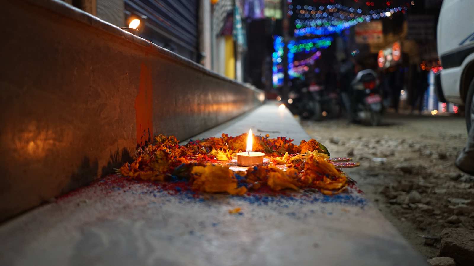 I got here right during Diwali, and on one of the nights every shop put out these offerings or a colorful flower pattern called Rangoli in front of their shop.