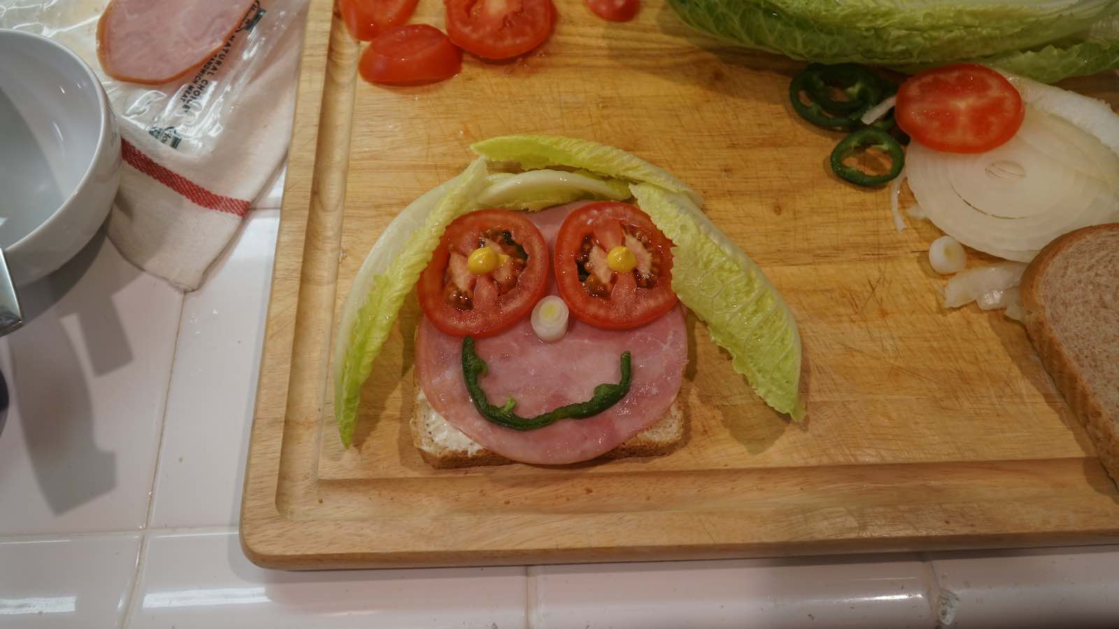 A week ago I was taking my sweet time making sandwiches. I started to play around and make faces in them and ended up laughing so hard by myself in the kitchen. An hour later I had made a bunch of different ones and took photos of them all. Living in the present or slightly delusional? You can decide, but it was hilarious.