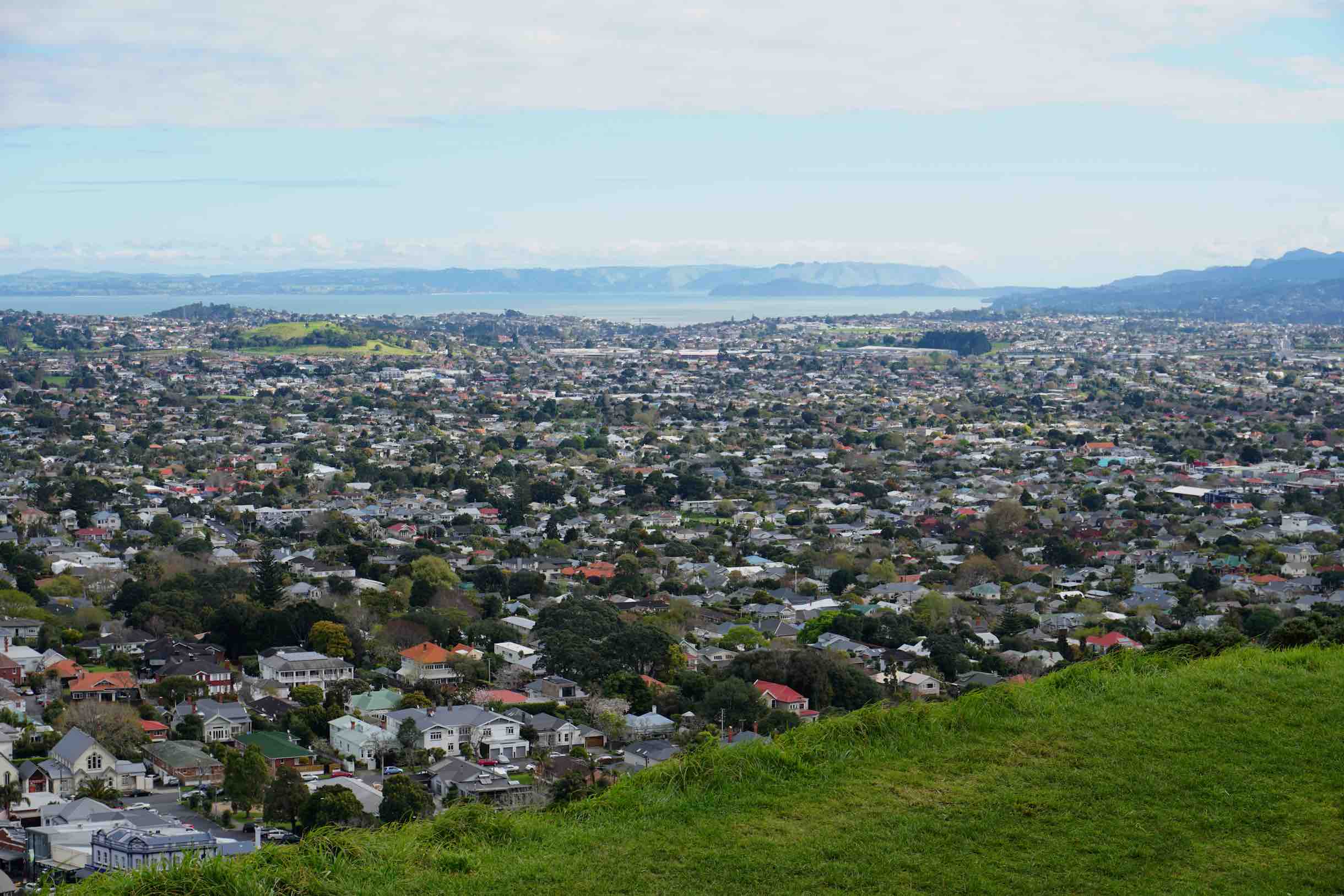 The suburbs of Auckland from Mount Eden. A dormant volcano now covered by grass and foliage, right in the middle of Auckland.