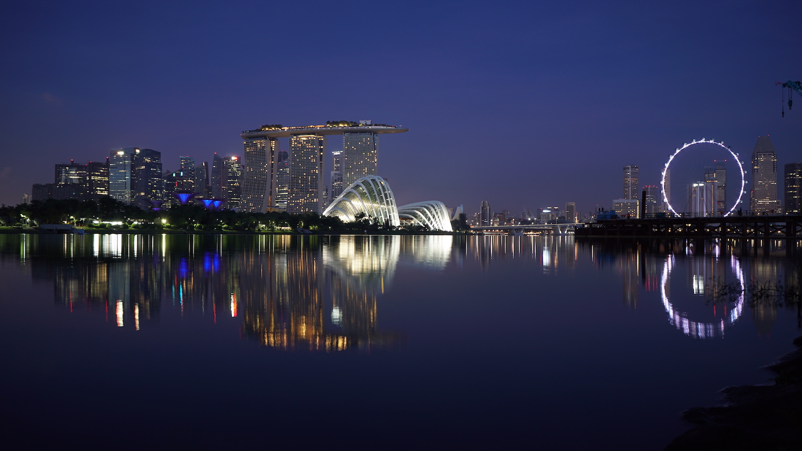 Took a taxi to Marina Bay in the morning around 5am in the morning. I was able to get there early enough to get a great photo of the city lights reflecting over the quiet morning waters in the bay before sun came up.